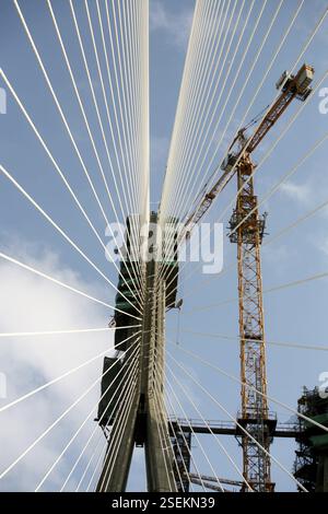 Crane at twin carriageway cable stayed bridge view of under ...