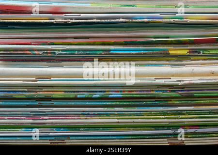 stack of books in close-up, pile of old used books and papers abstract background, collection of textbooks or notebooks, educational or academic Stock Photo
