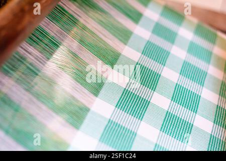 Traditional abel cloth with colorful geometric patterns being woven on a loom in Abra Philippines Stock Photo
