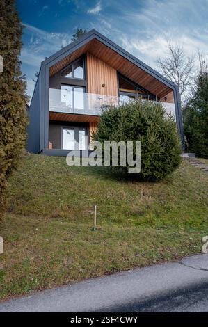 A modern house facade with sheet metal covering and an installed ...