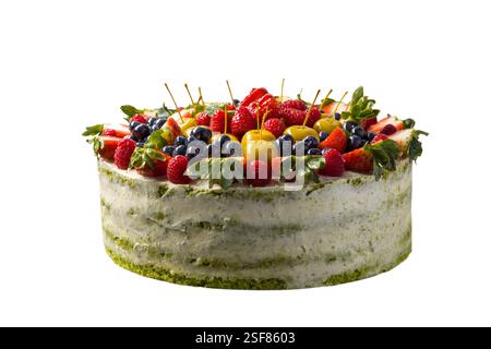 Delicious layered cake with light green frosting and fresh berries. Rustic and homemade look. Isolated on a light gray background. Perfect for dessert Stock Photo