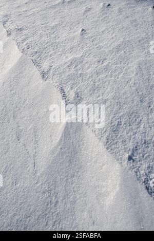 Shapes, textures, patterns created by snow and wind. Stock Photo