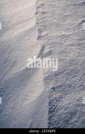 Shapes, textures, patterns created by snow and wind. Stock Photo