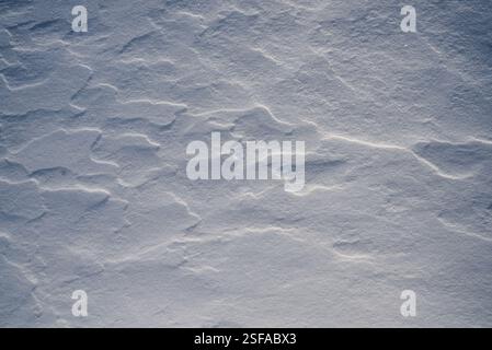 Shapes, textures, patterns created by snow and wind. Stock Photo