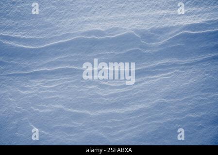 Shapes, textures, patterns created by snow and wind. Stock Photo