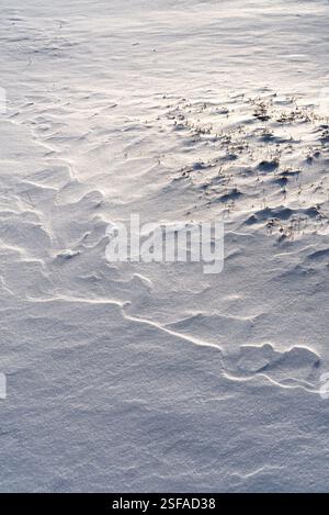 Shapes, textures, patterns created by snow and wind. Stock Photo