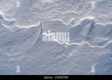 Shapes, textures, patterns created by snow and wind. Stock Photo