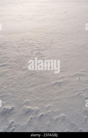 Shapes, textures, patterns created by snow and wind. Stock Photo