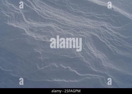 Shapes, textures, patterns created by snow and wind. Stock Photo