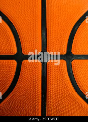 Closeup detail of basketball ball texture background. Sports equipment concept. Stock Photo