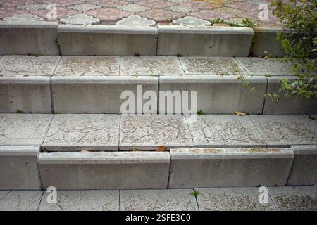 damaged tiled steps of outdoor staircase, daylight shot, no people Stock Photo