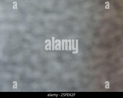 defocused ripple gray blurry noisy texture full frame, background dark abstract bokeh with blurred pattern, gray blur with empty copy space Stock Photo