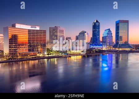 Jacksonville, Florida, USA. Cityscape image of Jacksonville, Florida with reflection of the city skyline in the water at beautiful sunrise. Stock Photo
