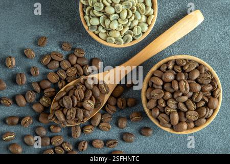 Green coffee with roasted coffee beans on gray background,top view Stock Photo