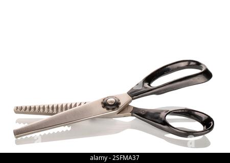 One tailor's scissors, close-up, isolated on a white background. Stock Photo