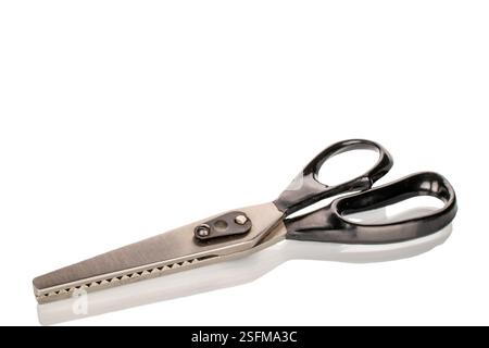 One tailor's scissors, close-up, isolated on a white background. Stock Photo