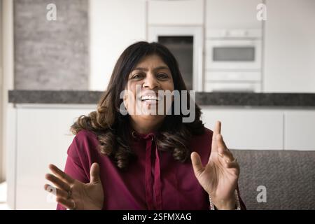 Woman leads online talk to family or friend using videocall Stock Photo