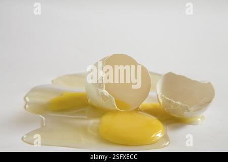 Concept, anda broken egg yolk death destroy life end on white background Stock Photo