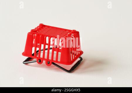 Empty inverted shopping basket on white background - Concept of shopping basket abandonment Stock Photo
