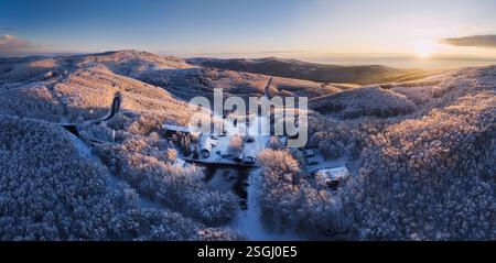 Fantastic sunrise in the mountains. Fresh snow covered slopes and fir trees in Carpathian mountains, Slovakia, Europe. Ski tour on untouched snowy hil Stock Photo