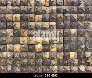 Close up of crafted wood mosaic wall tiles. Square timber wooden mosaic tile in natural dark color, seamless background texture. Stock Photo