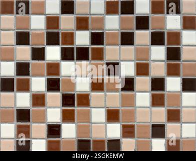 Close up of brown beige mosaic wall tiles. Square mosaic tile in various brown, black, white and peach color, seamless background texture Stock Photo