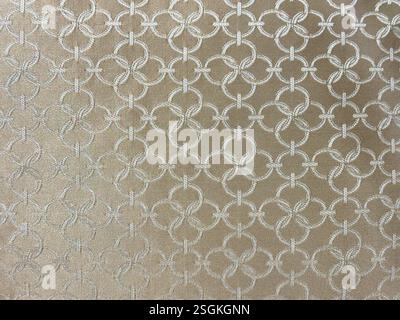 A metallic gold curtain texture with vertical folds, warm reflective ...