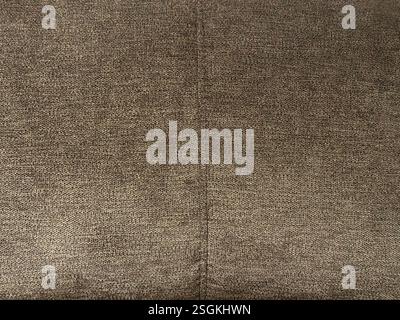 Texture of shiny brown suede fabric, suitable for upholstery and sofa covering. Brown bronze fabric seamless background texture. Stock Photo