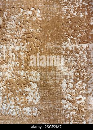 Random abstract carpet rug texture in floral ornamental pattern with golden brown color. Stock Photo