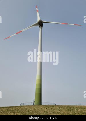 Wind turbine set against a clear blue winter sky Stock Photo - Alamy