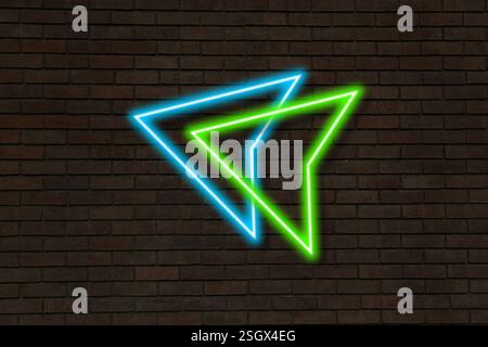 Bright neon arrow-shaped pointer on brick wall Stock Photo