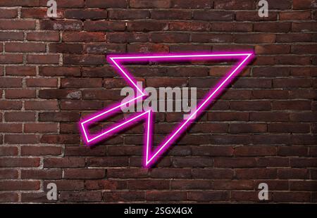 Pink neon arrow-shaped pointer on brick wall Stock Photo