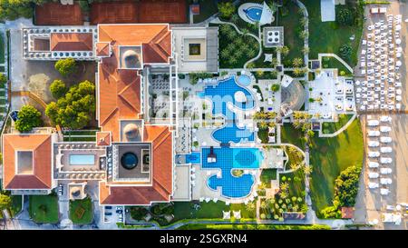 Aerial view of a luxury resort with elegant architecture, pools, and ...