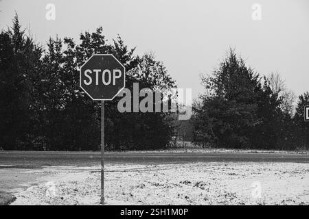 Stop Sign with Snow-Covered Ground Stock Photo