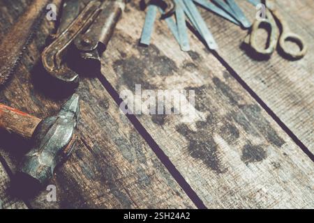 Rustic workshop tools arranged on a wooden bench showcase craftsmanship and creativity in a working space Stock Photo