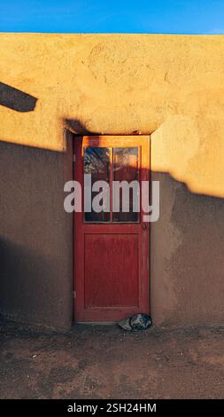 Rustic Adobe Doorway in a Traditional Mud-Brick House Stock Photo