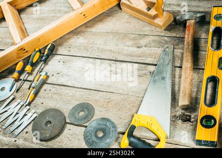 Collection of various woodworking tools and equipment on a rustic wooden workbench Stock Photo