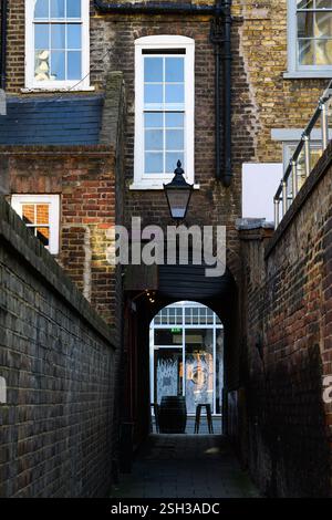 London, UK - September 18, 2024; Narrow St Johns Path in London with brick walls and old building Stock Photo