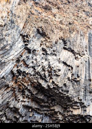 surface of wall in Garni Gorge from natural basalt columns in Symphony of the Stones site in Kotayk Province of Armenia on winter day Stock Photo
