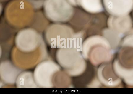 Abstract background of coins. Blurred image with bokeh effect Stock Photo