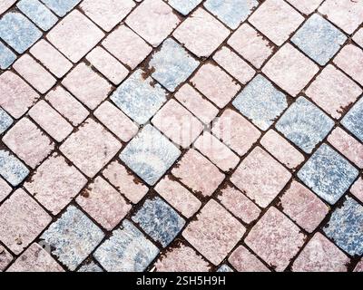 textured background - brown and gray stone tiled road paving Stock Photo
