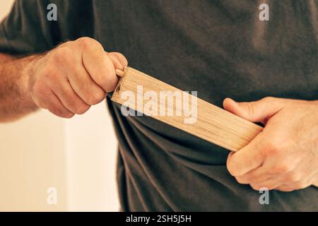 Using wooden dowels while assembling furniture at DIY home project, selective focus Stock Photo