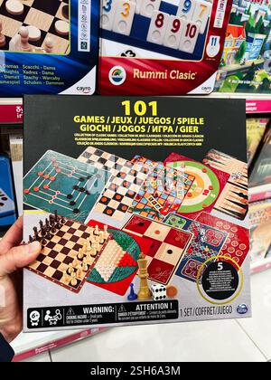 Kyiv, Ukraine - February 09, 2025: Colorful boxed set of 101 games including family favourites like chess and checkers. Stock Photo