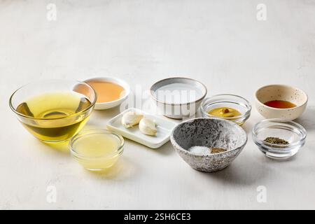various salad dressing ingredients on white table background Stock Photo