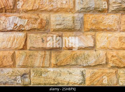 Pattern detail of rough stone bricks forming a wall Stock Photo