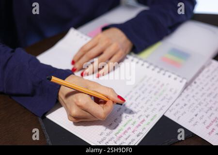 writes on the table in a notebook business people shaking hands takes notes Stock Photo