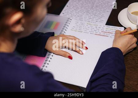 writes on the table in a notebook business people shaking hands takes notes Stock Photo