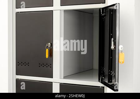 Modern lockers with bright keys indoors, closeup Stock Photo