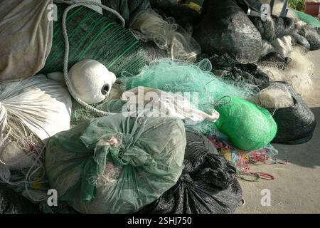 Fishing nets, white float and ropes on the floor. Fishing industry concept. Stock Photo