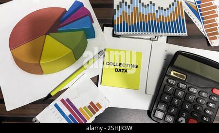 Concept of Collecting Data write on sticky notes isolated on Wooden Table. Stock Photo